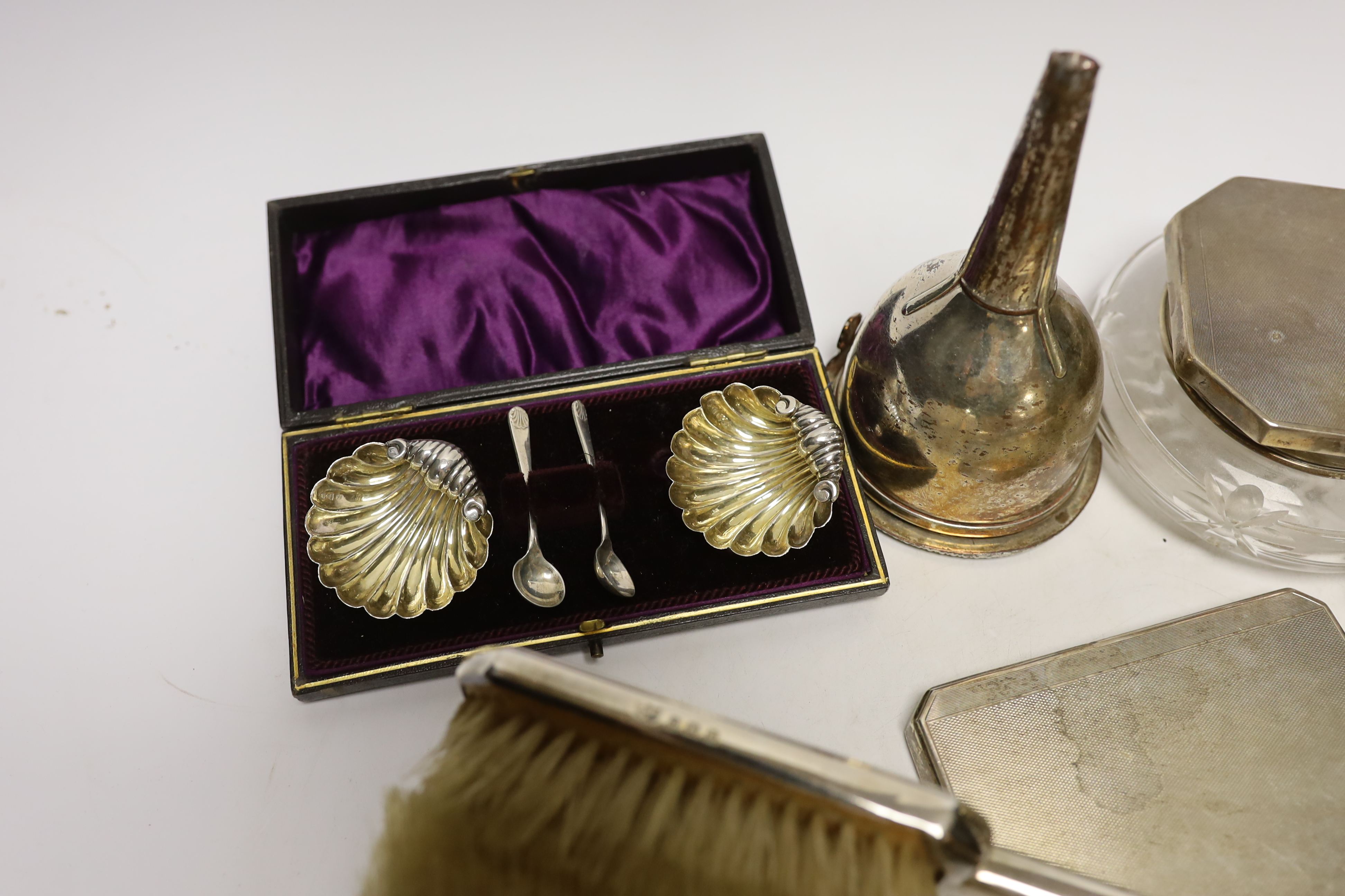 A group of assorted small silver, including a powder jar, trinket box, cigarette case, mirror and brush set etc. and a plated wine funnel.
